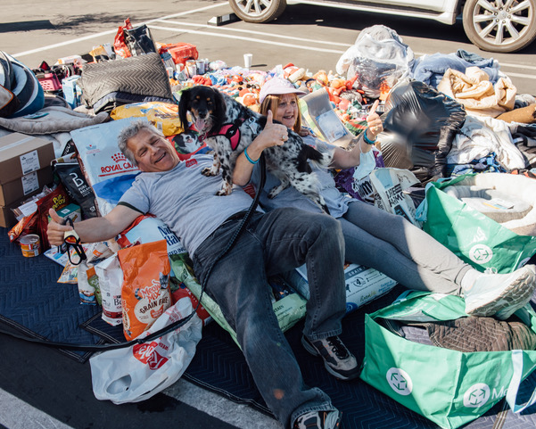 Co-founders Eileen and Brad Smulson lay on the bountiful donation from a Collection Drive hosted by Jordyn Taylor of 12 Months of Giving